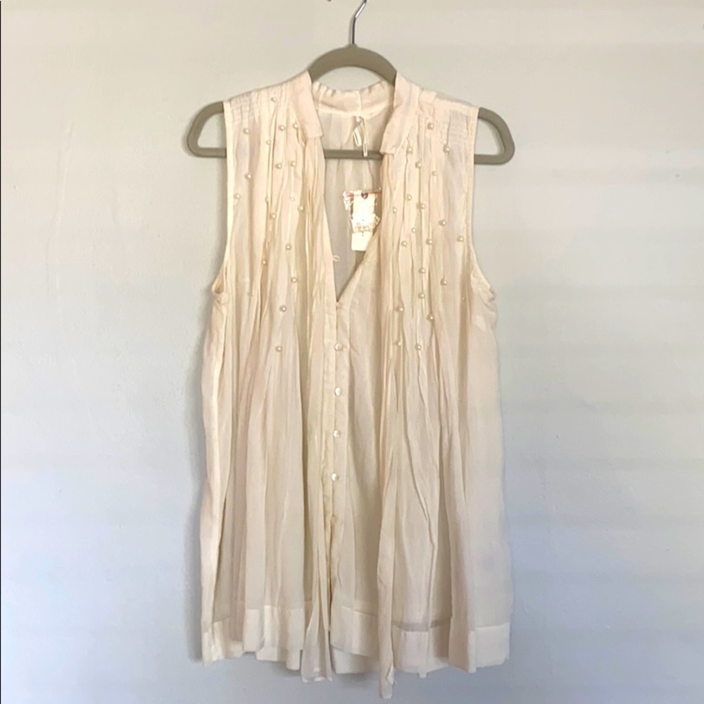 Sleeveless pearl embellished swing top